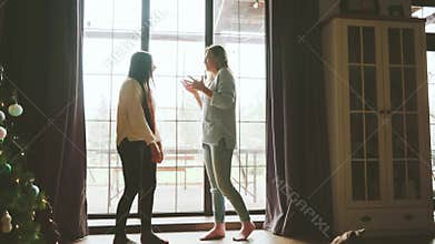 two joyful happy women friend, actively communicating talking loudly, gesturing waving their hands. adult girls