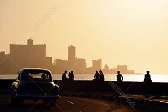 People and skyline of La Habana, Cuba, at sunset