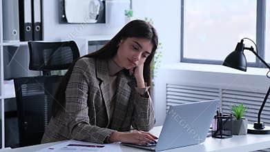 Businesswoman Suffers From Boredom At Work In The Office