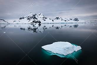Tranquil winter landscape with floating ice in Skontorp Cove, Antarctica.