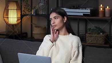 Pensive Woman Author With Laptop On Sofa