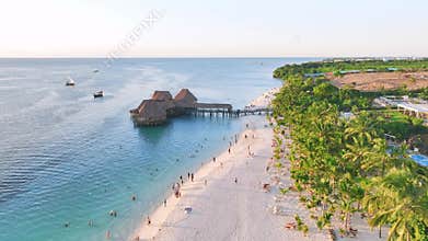 Aerial view of beautiful bungalow and sea at sunset in summer