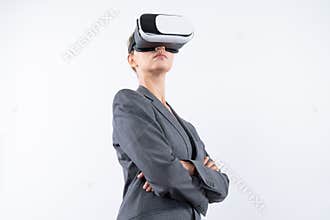 Caucasian businesswoman crossing arms while wearing VR glasses. Contraption.