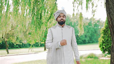 Inside the Indian wedding, the bridegroom brides together and worships the Lord. Happy indian groom handsome portrait