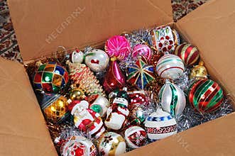Christmas ornaments in cardboard box.