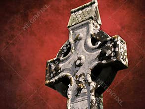 Celtic cross on a blood red colour grunge textured background