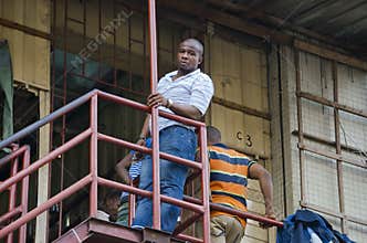Man leaning on a balcony
