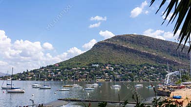 A landscape with a cuesta, a sloping rock layer, which slopes away from Hartbeespoort dam
