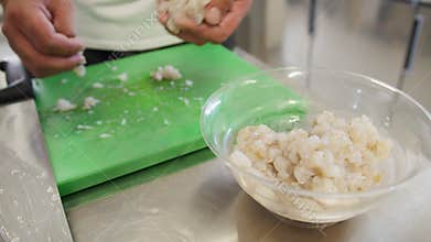 Chef Is Taking Pieces Of Swordfish Into A Bowl