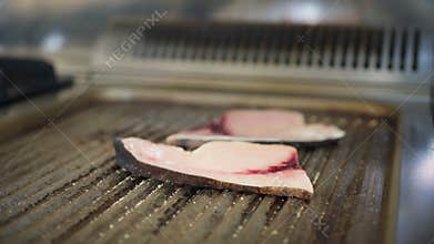 Cooking Swordfish On The Electric Grill Of A Restaurant