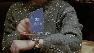 Woman smart watch text Drone delivery