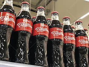 Coca-Cola local brand replica bottles on shelfs in Russia
