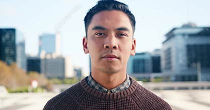 Portrait Of Young Adult Businessman In City