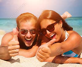 Couple in Sunglasses on the Beach