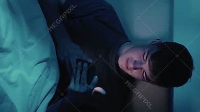 Vertical Gadget night man using phone in bed