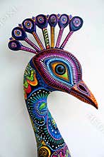 Peacock head featuring vibrant tribal designs.