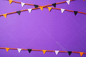 Halloween bunting flag garland on purple background. Happy Halloween concept