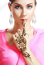 Woman face henna on hand