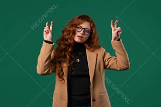 Sarcastic BusinessWoman. hands two fingers air quotes gesture on green, sarcasm