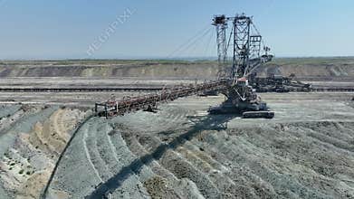Top shot of a large bucket-wheel excavator in a lignite (brown-coal) mine. ?erial view.