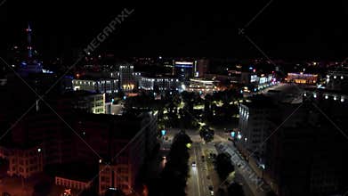 Aerial night illuminated Freedom Square dolly