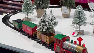 Christmas train set moving on white background