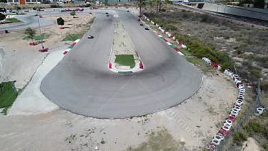 A sharp turn in the road on a go-kart track, drone shooting.