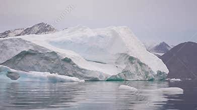 Massive Iceberg in Cold Water of Fjord, Svalbard Island Archipelago, Norway