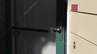 Man Ringing Front Door Bell and Knocking