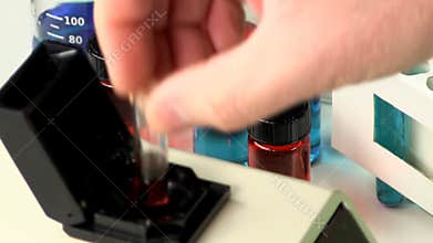 Testing cuvette of red liquid