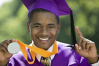 Closeup Of A Graduate Showing His Medal