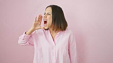 Bewildered and beautiful, young hispanic woman in pink, arms akimbo, clueless and doubtful - she\'s got no idea what to decide,