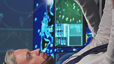 Workplace of the air traffic controllers in the control tower. Team of professional aircraft control officers works