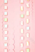 Pink kawaii background with borders of sweet meringue and marshmallows