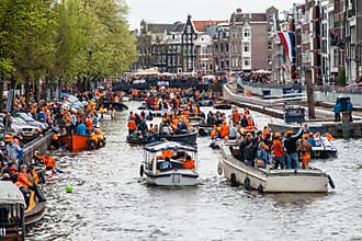 Happy people on boat at Koninginnedag 2013