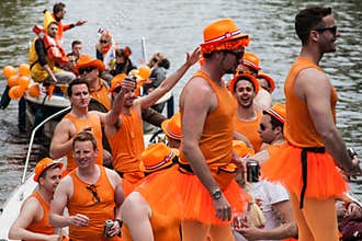 Group dressed like womans at Koninginnedag 2013