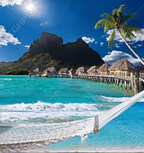 Palms , hammock and ocean. Bora-Bora. Polynesia