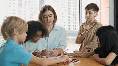 Student and teacher drawing and coloring by using marker or crayon. Erudition.