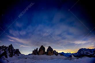 Tre Cime towers in the Dolomites in winter at night