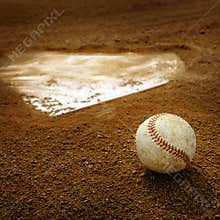 Old Leather Baseball on Field by Home Plate or Base