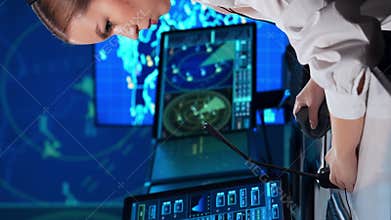 Workplace of the air traffic controllers in the control tower. Team of professional aircraft control officers works