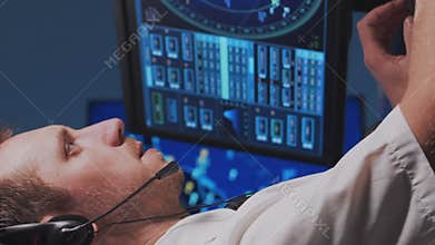 Workplace of the air traffic controllers in the control tower. Team of professional aircraft control officers works