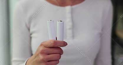 Woman holds Energizer AA lithium batteries