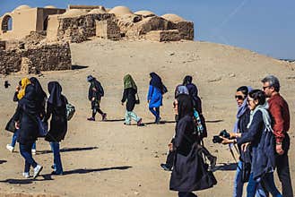 Tourists in Dakhma - Tower of Silence, historic structure built by Zoroastrians in Yazd city