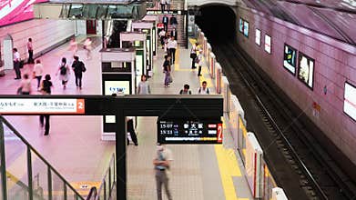 Timelapse of busy crowded Japanese people passenger at subway station transportation platform