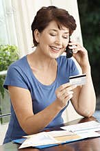 Woman Paying Credit Card Using Cellphone