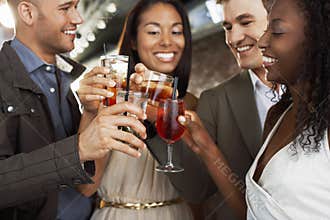 Couples Toasting Drinks At Bar