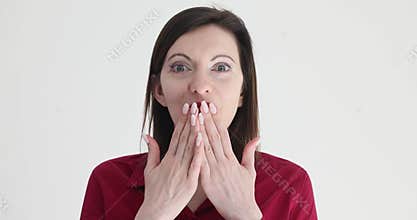 Portrait of a beautiful woman expressing shock and amazement