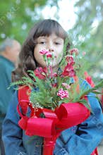 Young girl carrying flowers