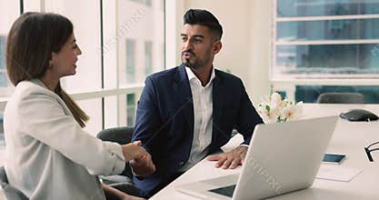 Advisor consulting to client, shake hands, feel satisfied with cooperation